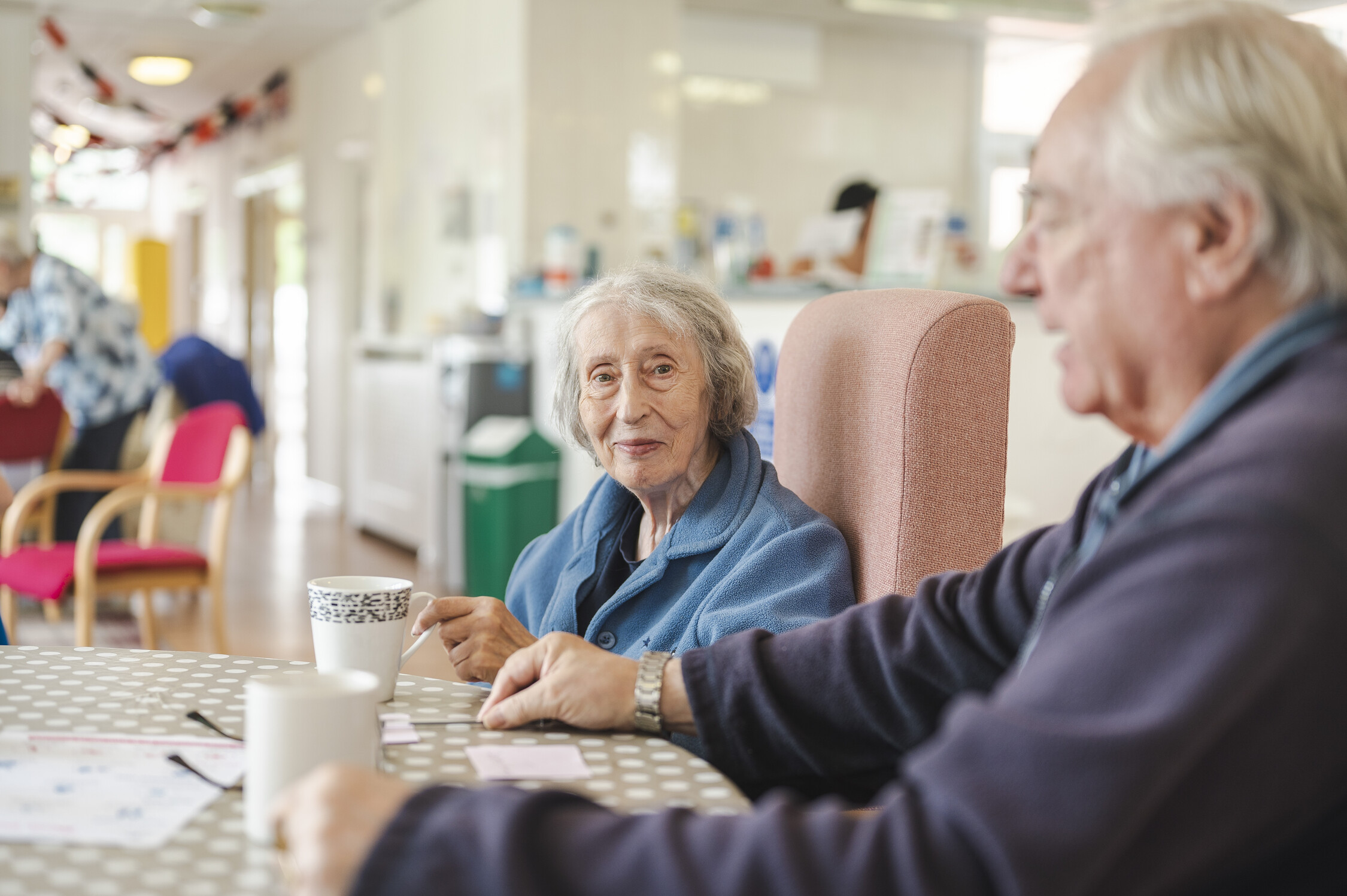 Two people around a table 