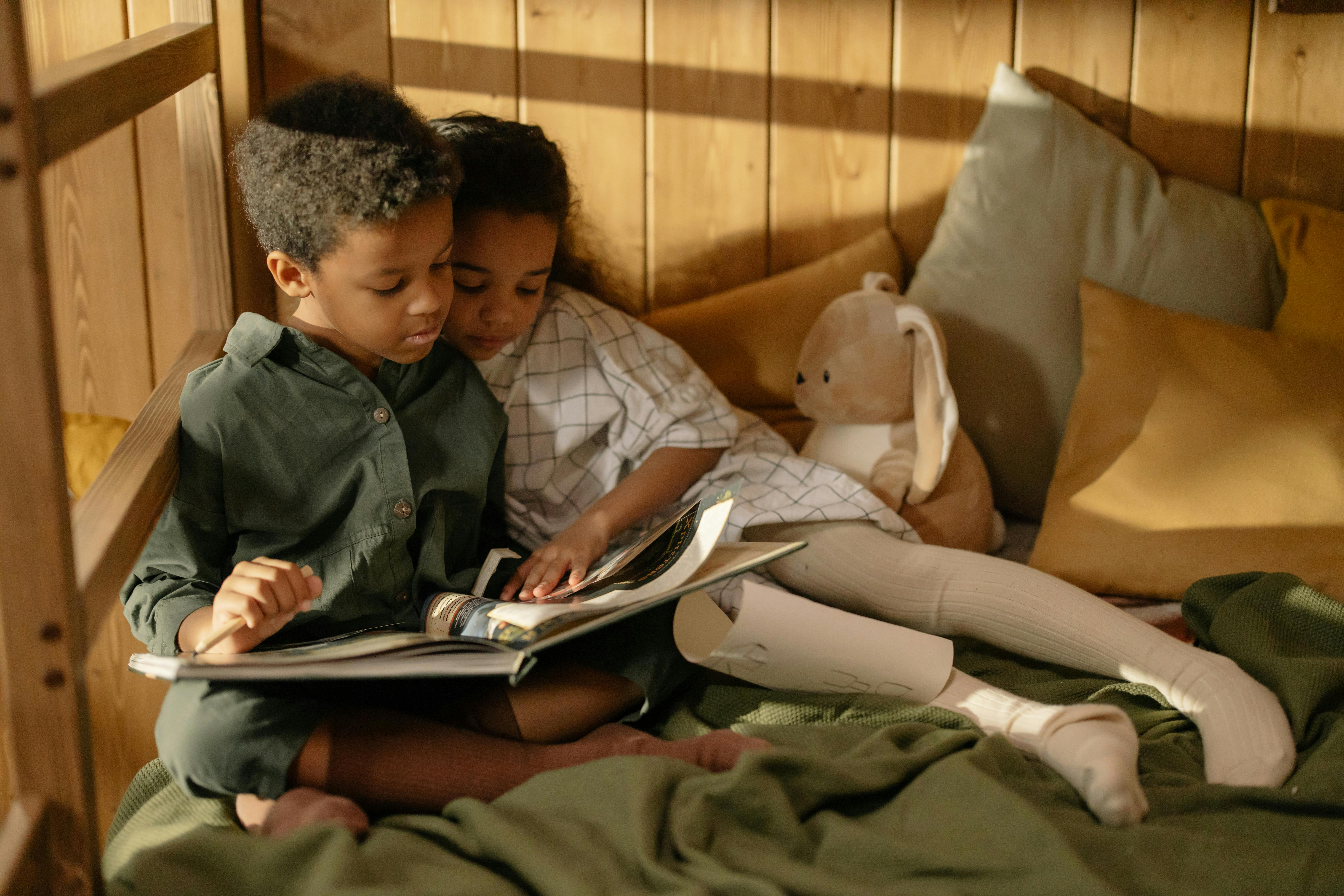 two children reading a book