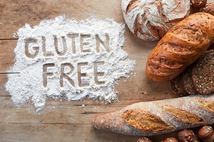 gluten free is written in flour, surround by bread